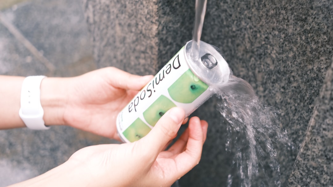 a person is spraying water on a wall