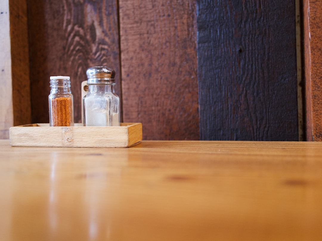 a couple of bottles sitting on top of a wooden table