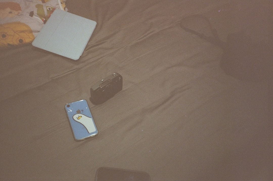 A laptop computer sitting on top of a bed