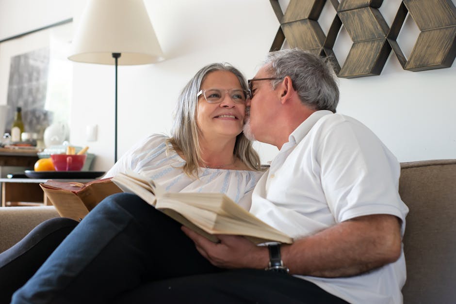Senior couple relaxing and enjoying a book together indoors in Portugal