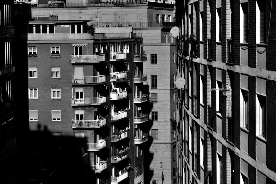 Grayscale photo of apartment buildings in Naples, Italy, highlighting urban design.