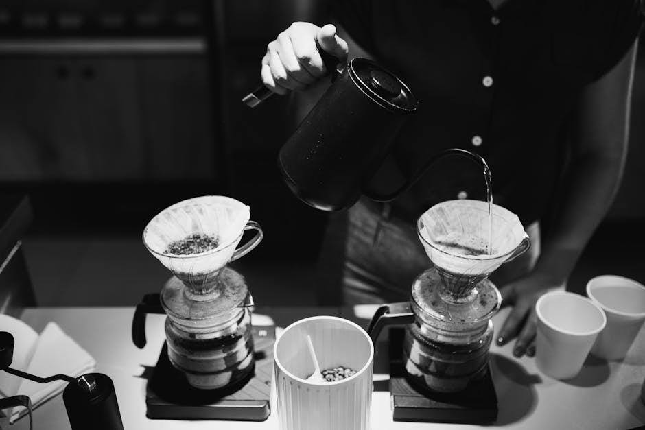 A barista artistically pouring coffee in a café setting, highlighting the brewing process.