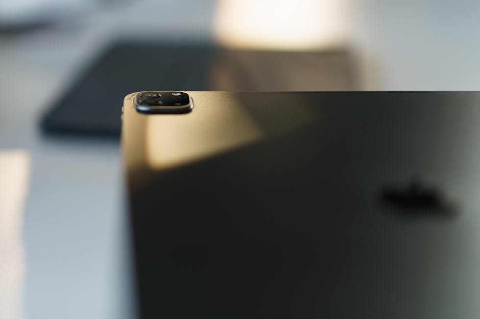 Close-up image of a tablet camera module in soft lighting, ideal for tech visuals.