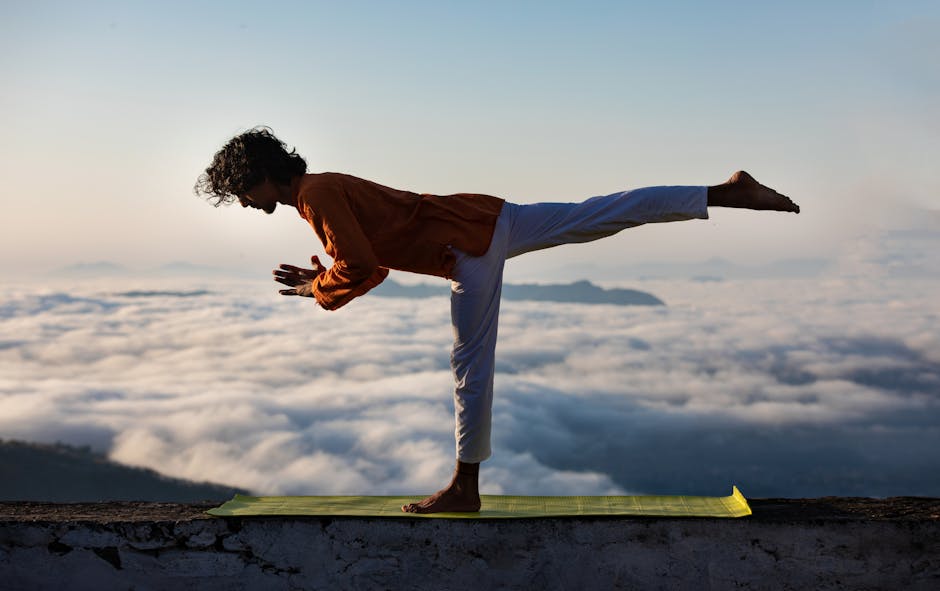 A man performs yoga on a rooftop, surrounded by clouds and a serene landscape during the day.